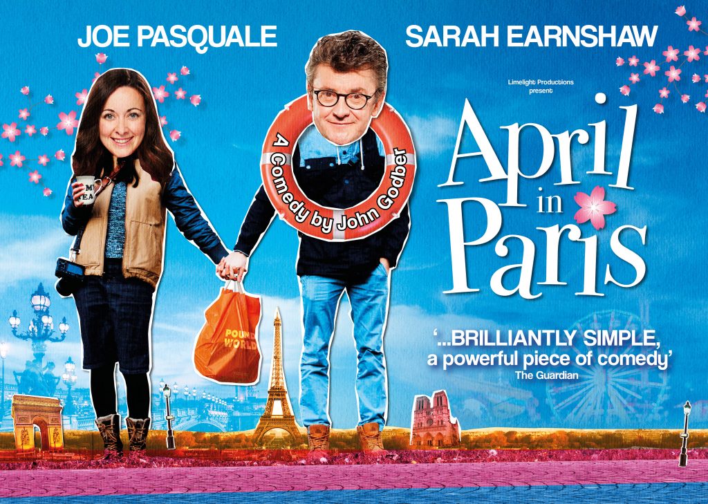 April in Paris artwork featuring Sarah Earnshaw and Joe Pasquale holding hands with a Pound World carrier bag between them. Joe has a life ring around his neck, and there's a mini Paris skyline in the background