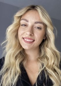 A head and shoulders image of a young woman