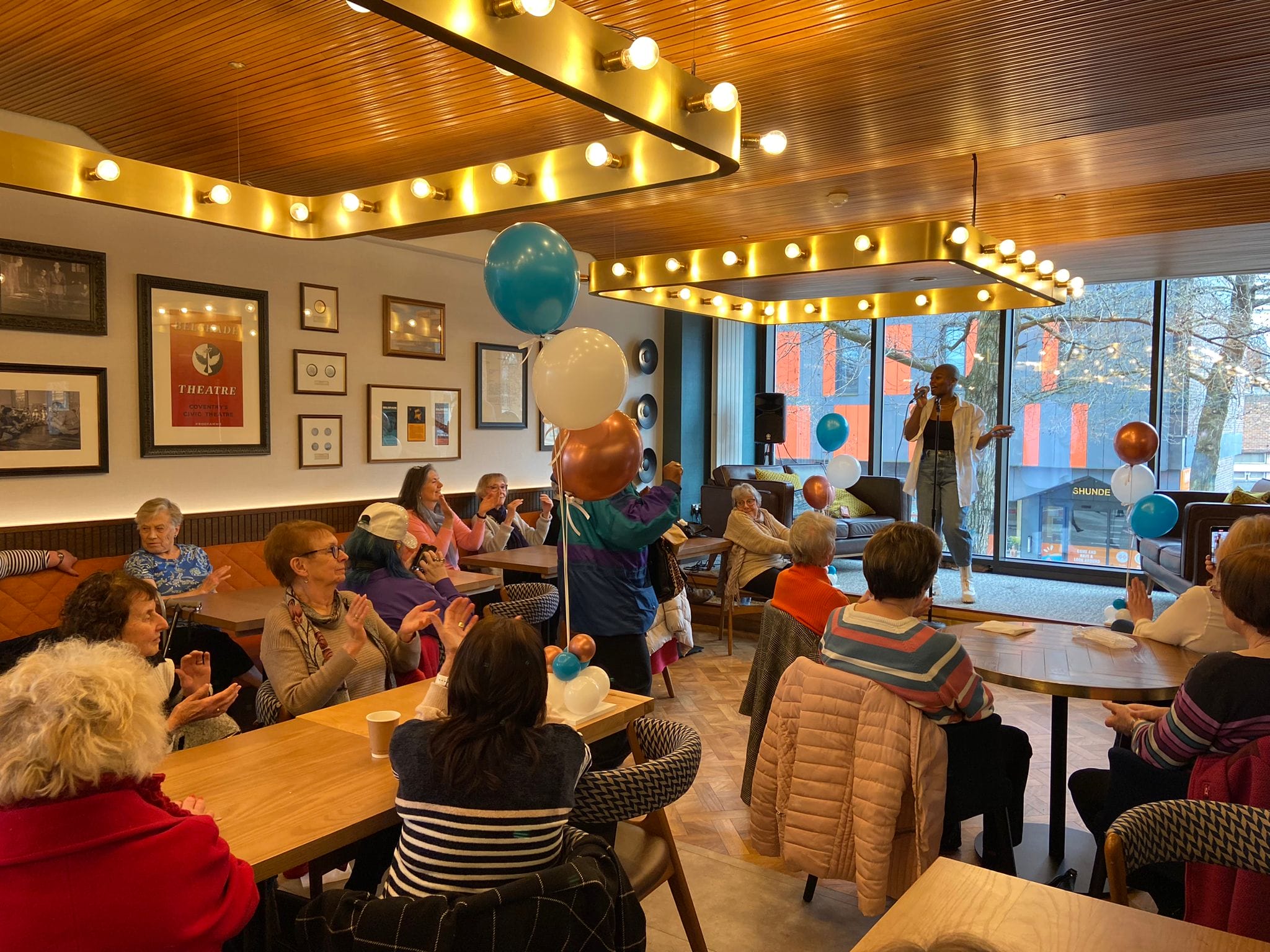 Guests singing and dancing with Alexia McIntosh.