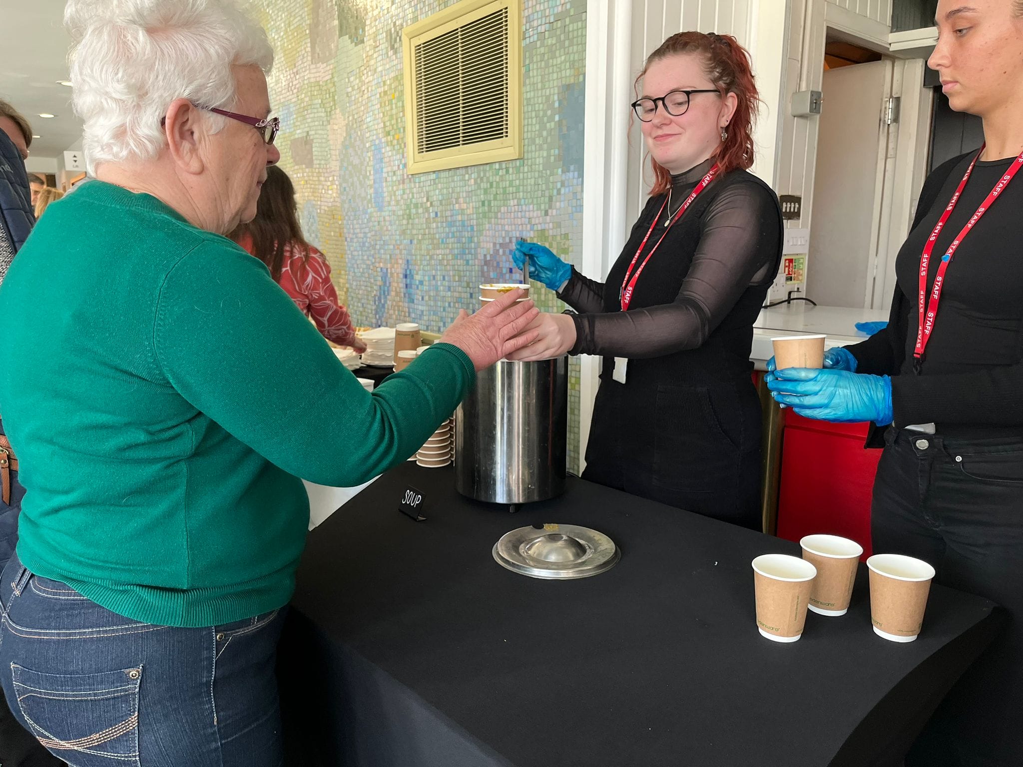 Lunch including soup, sandwiches, and cake was served up.