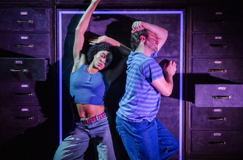 Joe Layton (Robbie) and Hannah Sinclair Robinson (Jess) in Lost Atoms. Lost Atoms is Frantic Assembly's 30th Anniversary production. Cr. Tristram Kenton.