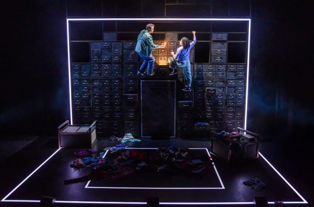 Joe Layton (Robbie) and Hannah Sinclair Robinson (Jess) in Lost Atoms. Lost Atoms is Frantic Assembly's 30th Anniversary production. Cr. Tristram Kenton.