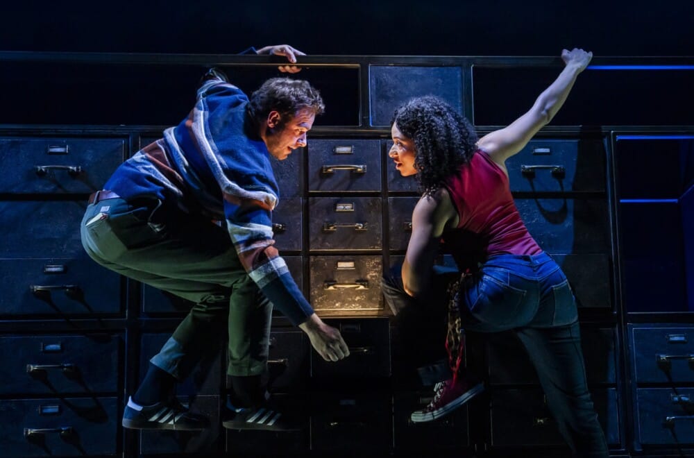 Joe Layton (Robbie) and Hannah Sinclair Robinson (Jess) in Lost Atoms. Lost Atoms is Frantic Assembly's 30th Anniversary production. Cr. Tristram Kenton.