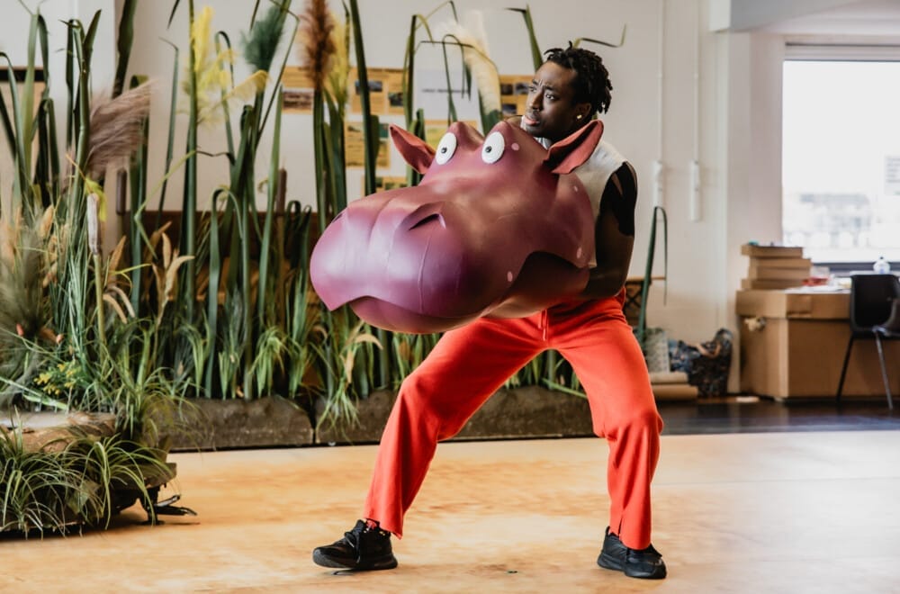 The UK Tour cast rehearsing The Enormous Crocodile.