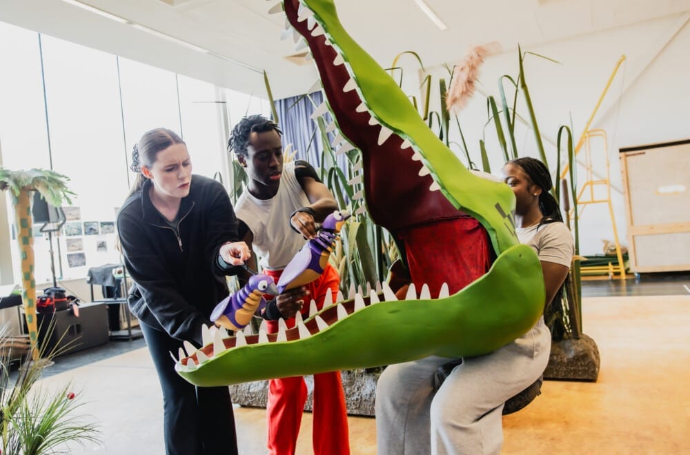 The UK Tour cast rehearsing The Enormous Crocodile.